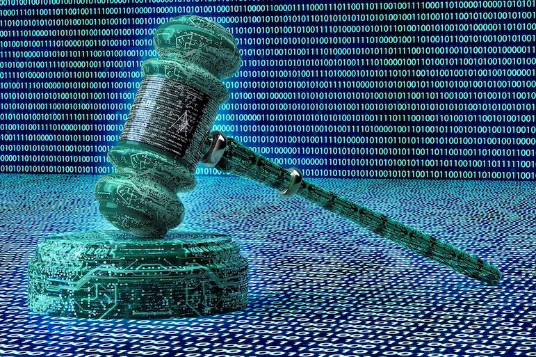 wooden gavel with binary code in the background