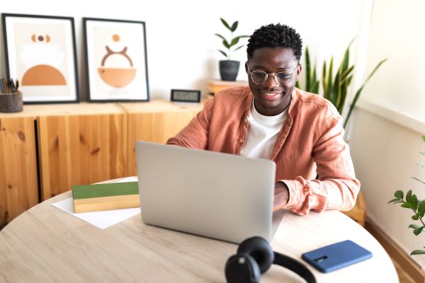 student reading on laptop